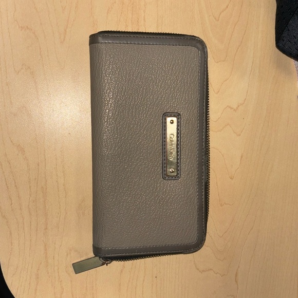 Calvin Klein Handbags - Lady zip 7.5 inch zippered around wallet. Color is TOUPEE. 2tone